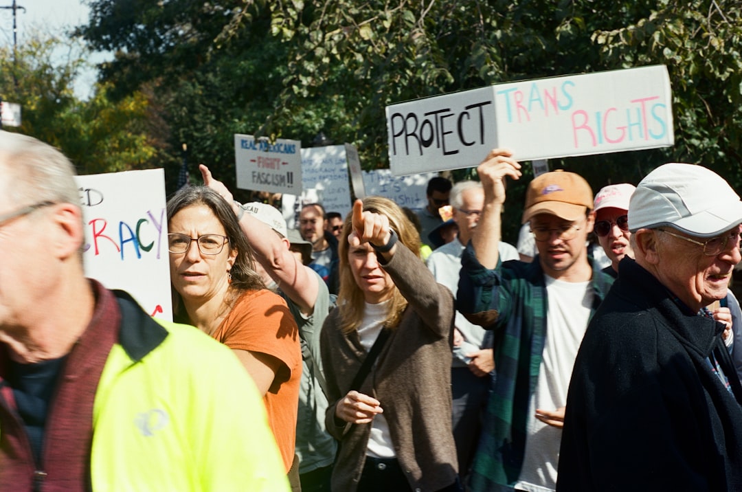 people-marching-with-protest-signs-gpncevsgrtm